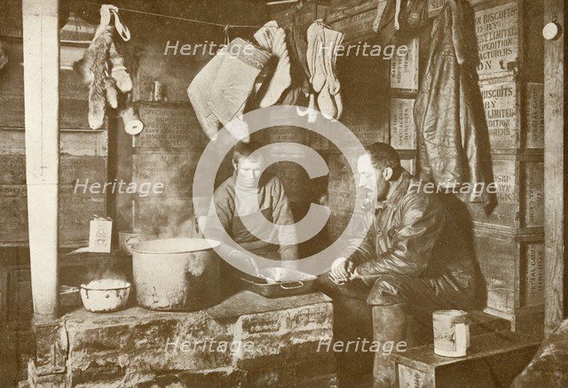 'Meares and Demetri at the Blubber Stove in the 'Discovery' Hut', 3 November 1911, (1913). Artist: Herbert Ponting.