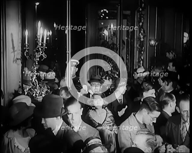 A Crowd of People Filing Into the Foyer of a Theatre, 1931. Creator: British Pathe Ltd.