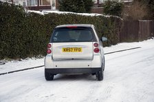 2007 Smart car sliding on snowy road Artist: Unknown.