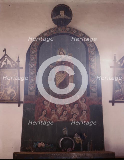 The altar of Nuestra Senora del Carmel on the south wall of the church, Trampas, N.M., 1943. Creator: John Collier.