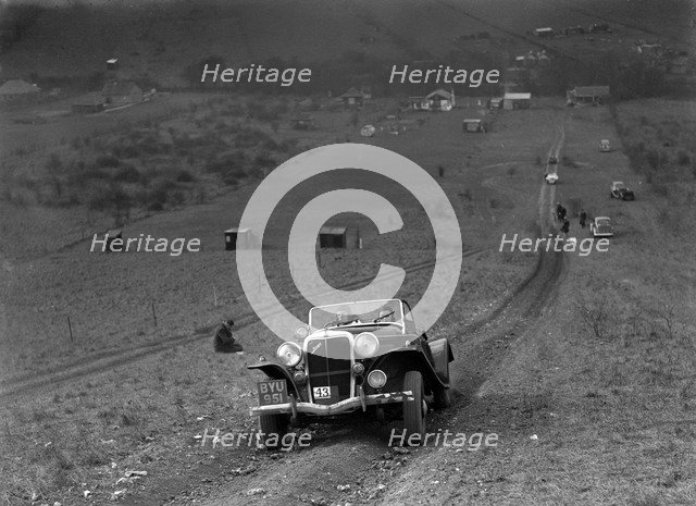 Jensen V8 competing in the London Motor Club Coventry Cup Trial, Knatts Hill, Kent, 1938. Artist: Bill Brunell.