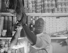 Mr. J. Benjamin, a store owner, Washington, D.C., 1942. Creator: Gordon Parks.