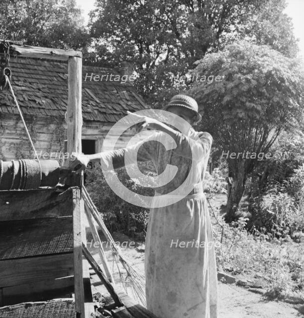 Caroline Atwater, wife of Negro owner, tells where she was born, 1939. Creator: Dorothea Lange.