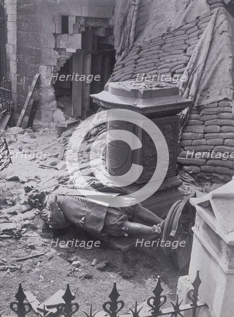Monument to John Milton and part of St Giles without Cripplegate after bomb damage, c1940. Artist: Anon