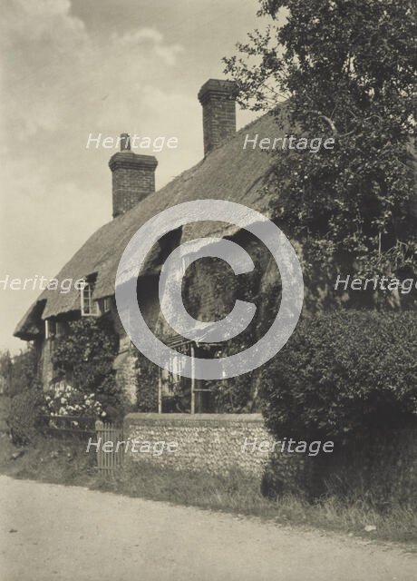 Thatched cottage. From the album: Photograph album - England, 1920s. Creator: Harry Moult.