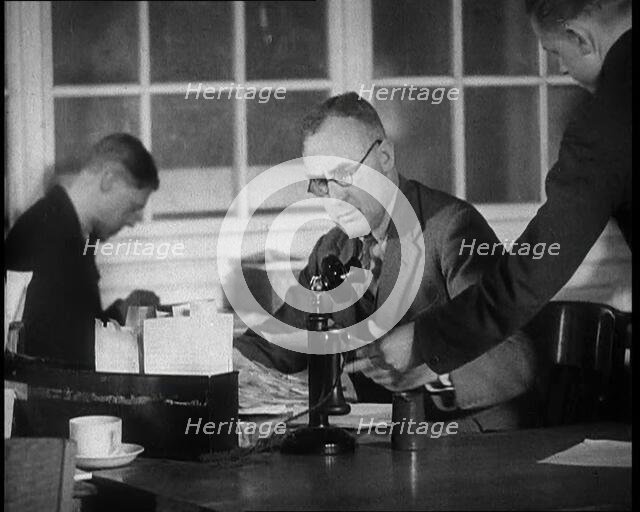 Journalist Being Handed Papers, 1933. Creator: British Pathe Ltd.
