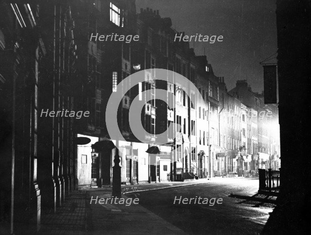 Street scene at night, Tottenham Court Road, Camden, London. Artist: Unknown