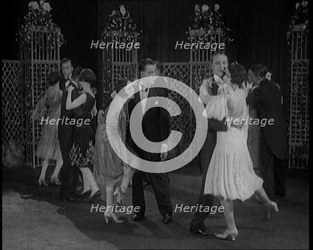 A Group of People Dancing the Charleston. One Female Civilian is Rubbing Her Legs is Pain, 1926. Creator: British Pathe Ltd.