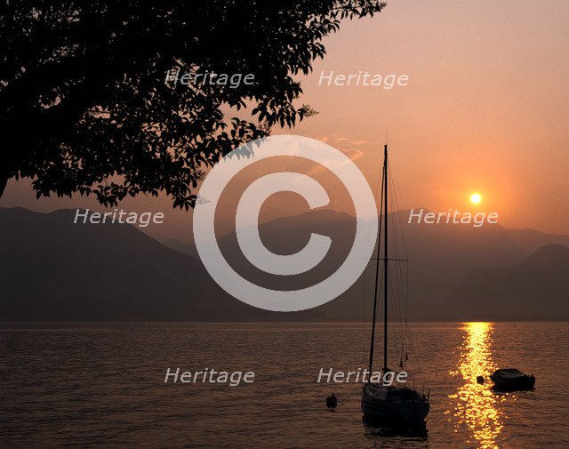 Yacht at sunset, Lake Maggiore, Italy.