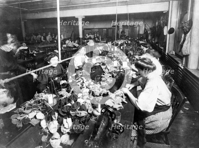 Women sewing teddy bears in a factory, c. 1915.