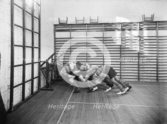 Students practicing rugby scrummaging, Launceston College, Cornwall, 1930s. Artist: Marshall Keene and Company.