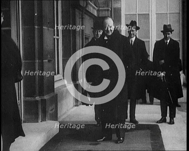 British Secretary of State for the Colonies Winston Churchill Exiting a Building, 1921. Creator: British Pathe Ltd.