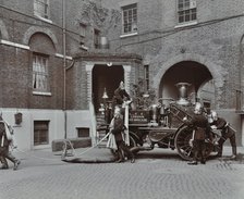 Firemen demonstrating motor steamer hoses, London Fire Brigade Headquarters, London, 1910. Artist: Unknown.