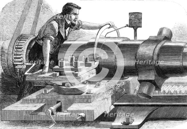 Manufacture of the Armstrong Gun at Woolwich Arsenal: finish-turning a 100-pounder, 1862. Creator: Unknown.