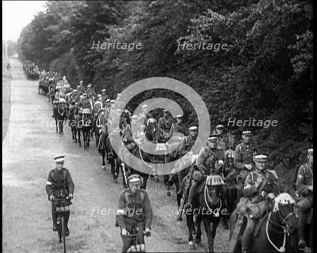 British Soldiers Riding Horses and Bikes on Salisbury Plain, 1933. Creator: British Pathe Ltd.