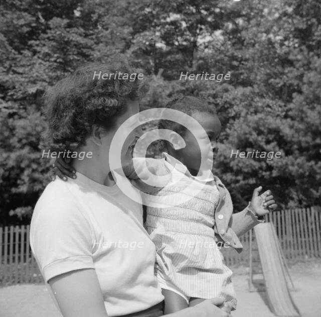 Mrs. Janet P. Murray with nursery school camper, Camp Ellen Marvin, Arden, New York, 1943. Creator: Gordon Parks.