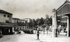 Regular bus at the stop of the bar Sport in Santa Coloma de Farners (Girona), on a postcard from …