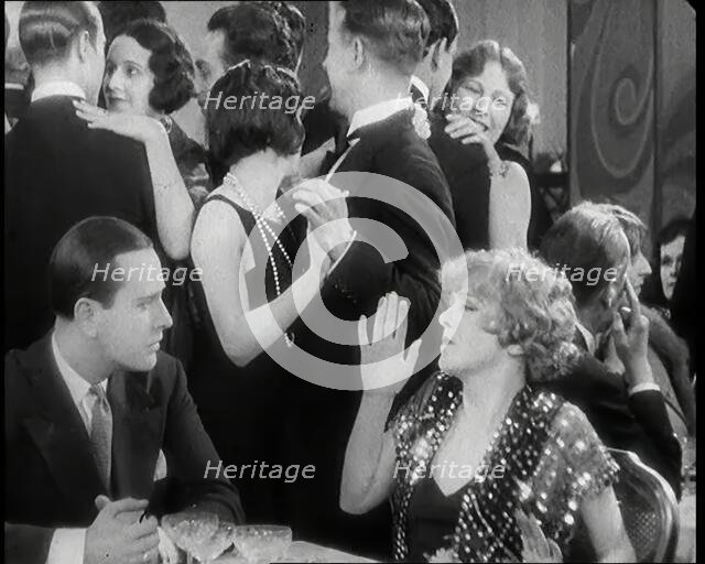 Scene from the Film 'Champagne': Betty Balfour in a Nightclub Drinking Champagne and..., 1920s. Creator: British Pathe Ltd.