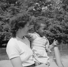 Mrs. Janet P. Murray with nursery school camper, Camp Ellen Marvin, Arden, New York, 1943. Creator: Gordon Parks.