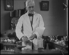 Dr Alexander Fleming, the Inventor of Penicillin, Experimenting in a Laboratory, 1929. Creator: British Pathe Ltd.
