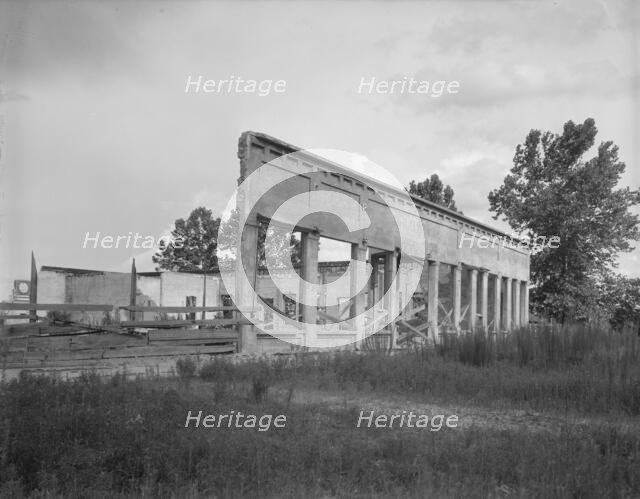 Remains of storefronts in Fullerton, Louisiana, an abandoned lumber town, 1937. Creator: Dorothea Lange.