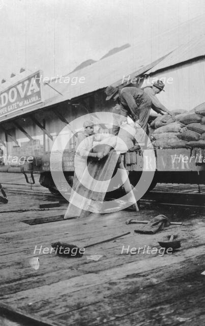 Loading copper, between c1900 and c1930. Creator: Unknown.