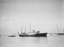 The twin screw 80ft motor yacht 'Bystander' at anchor, 1934. Creator: Kirk & Sons of Cowes.