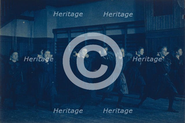 Female students exercising in a gymnasium, Western High School, Washington, D.C., (1899?). Creator: Frances Benjamin Johnston.