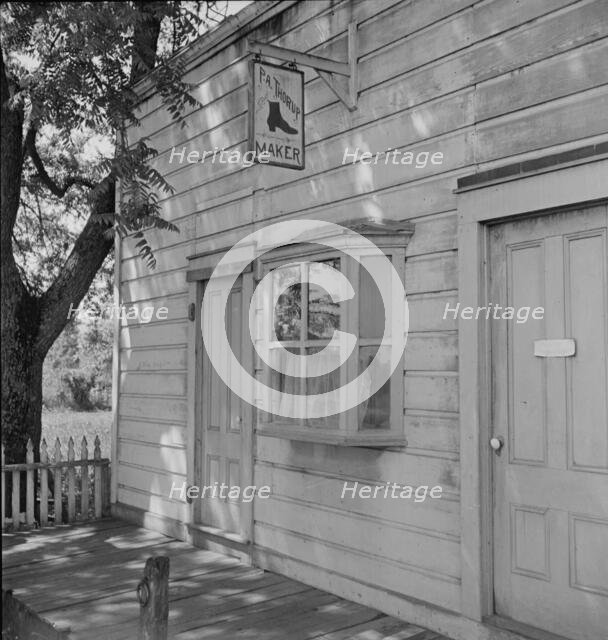 Boot and shoemaker shop in small California town, 1938. Creator: Dorothea Lange.