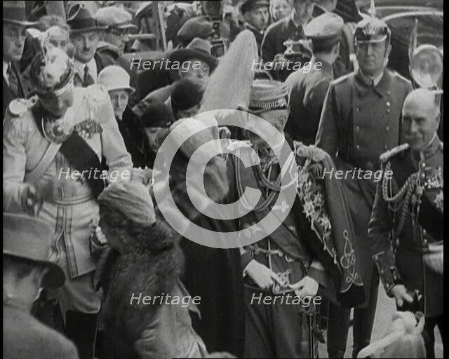 Crowds Watching a Group of Well Dressed People, 1930s. Creator: British Pathe Ltd.