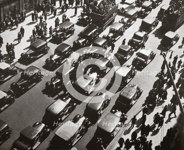 Traffic jam on Fifth Avenue at 49th Street, New York, USA, early 1929. Artist: Unknown