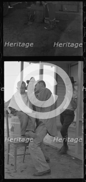 Community barber shop in Kern County migrant camp, California, 1936. Creator: Dorothea Lange.