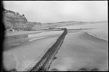 View looking north-east from Shanklin Beach, showing Admiralty scaffolding, Isle Of Wight, 1945. Creator: George R Long.
