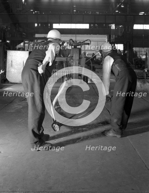 Rolling steel bars, Park Gate Iron & Steel Co, Rotherham, South Yorkshire, 1964. Artist: Michael Walters