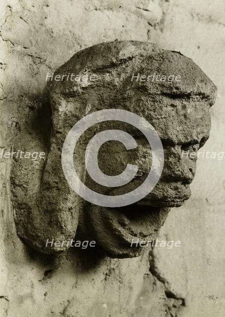 Ely Cathedral: Head in South Nave Triforium, c. 1891. Creator: Frederick Henry Evans.