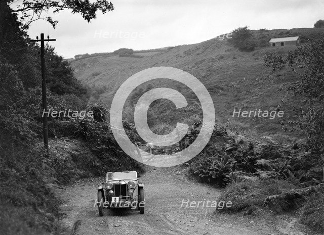 MG Magnette/Magna of the Three Musketeers team taking part in a motoring trial, Devon, late 1930s. Artist: Bill Brunell.
