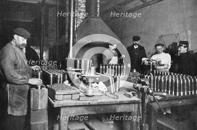 Filling shrapnel shells in a British munitions factory, World War I, 1914-1918. Artist: Unknown