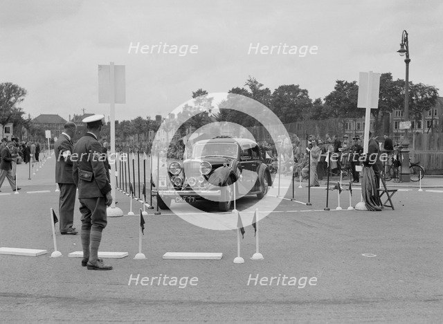 Jaguar SS saloon of DS Hand competing in the South Wales Auto Club Welsh Rally, 1937 Artist: Bill Brunell.