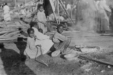 Louisiana Flood - refugees cook government rations, 1912. Creator: Bain News Service.