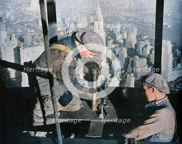 'Rivetting the last bolts on "The Morning Mast" of the Empire State building', c1931. Creator: Lewis Wickes Hine.