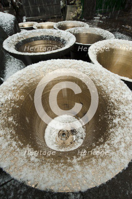 Snow on bells in the courtyard, Whitechapel Bell Foundry, Tower Hamlets, London, 2010. Artist: Derek Kendall.