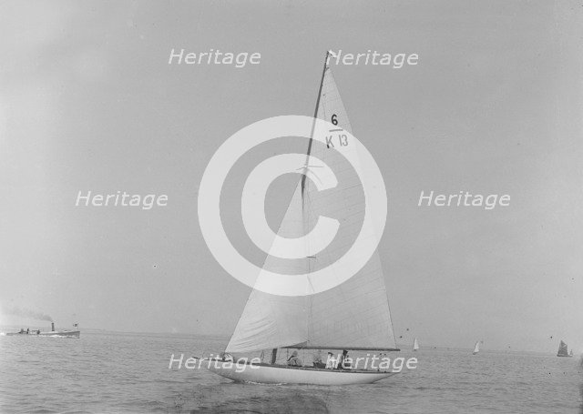 The 6 Metre 'Flya' (K13) sailing close-hauled, 1921. Creator: Kirk & Sons of Cowes.