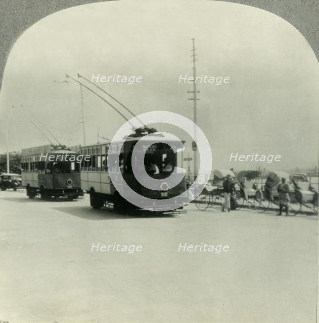 'Trackless Tram Cars in Singapore, Straits Settlement, British Malaya', c1930s. Creator: Unknown.