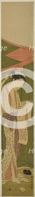 Woman Standing beside a Mosquito Net Reading a Letter, c. 1768/69. Creator: Suzuki Harunobu.