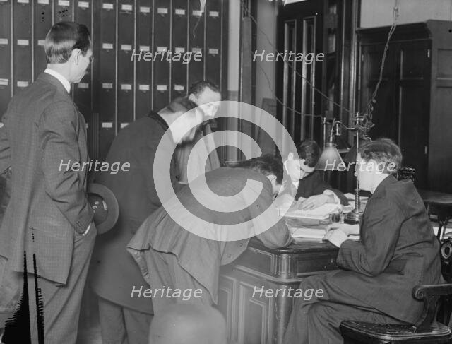 New citizens signing naturalization papers in judge's chambers, 1910. Creator: Bain News Service.
