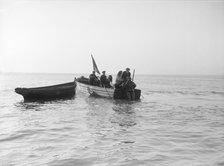 Preparing diver for sea salvage, 1912. Creator: Kirk & Sons of Cowes.