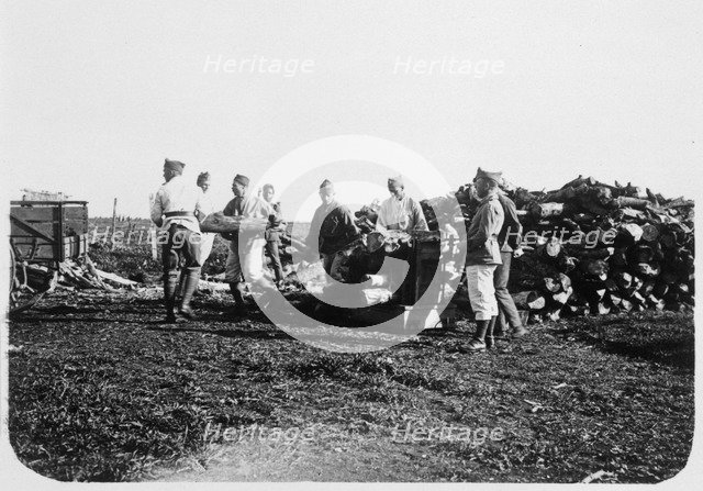 Soldiers of the French Foreign Legion stacking logs, Syria, 20th century. Artist: Unknown