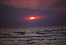 Sunset over Indian Ocean in Hikkaduwa, Sri Lanka, 20th century. Artist: CM Dixon.