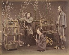 [Two Japanese Men and One Japanese Woman Posing with Flowering Branches], 1870s., Creator: Unknown.