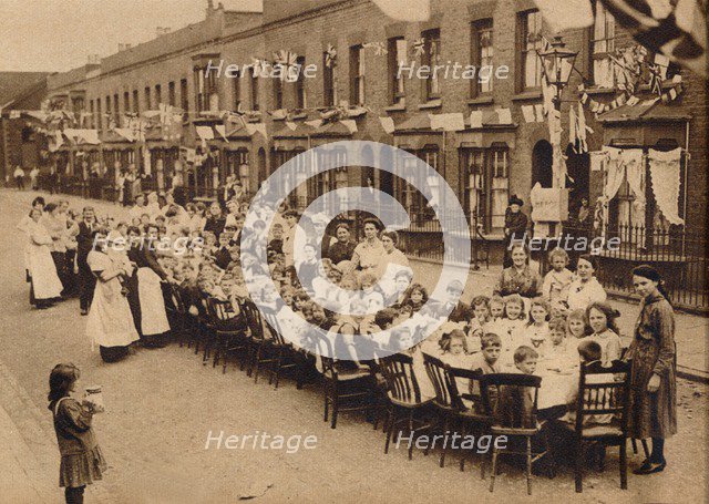 ' A children's tea party in an East End Street in London, to celebrate the Treaty of Versailles at t Artist: Unknown.